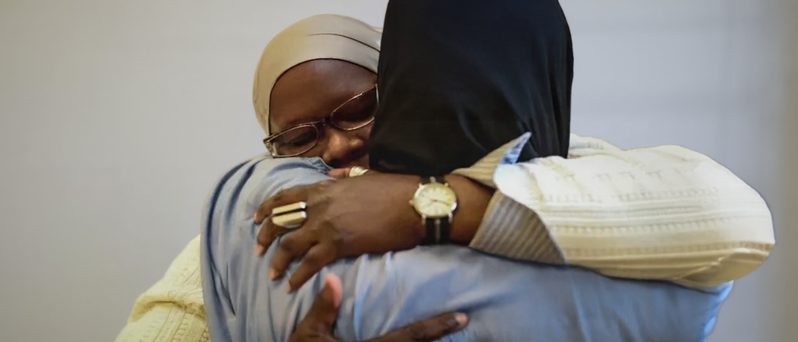 Dr. Renaya hugging showing care