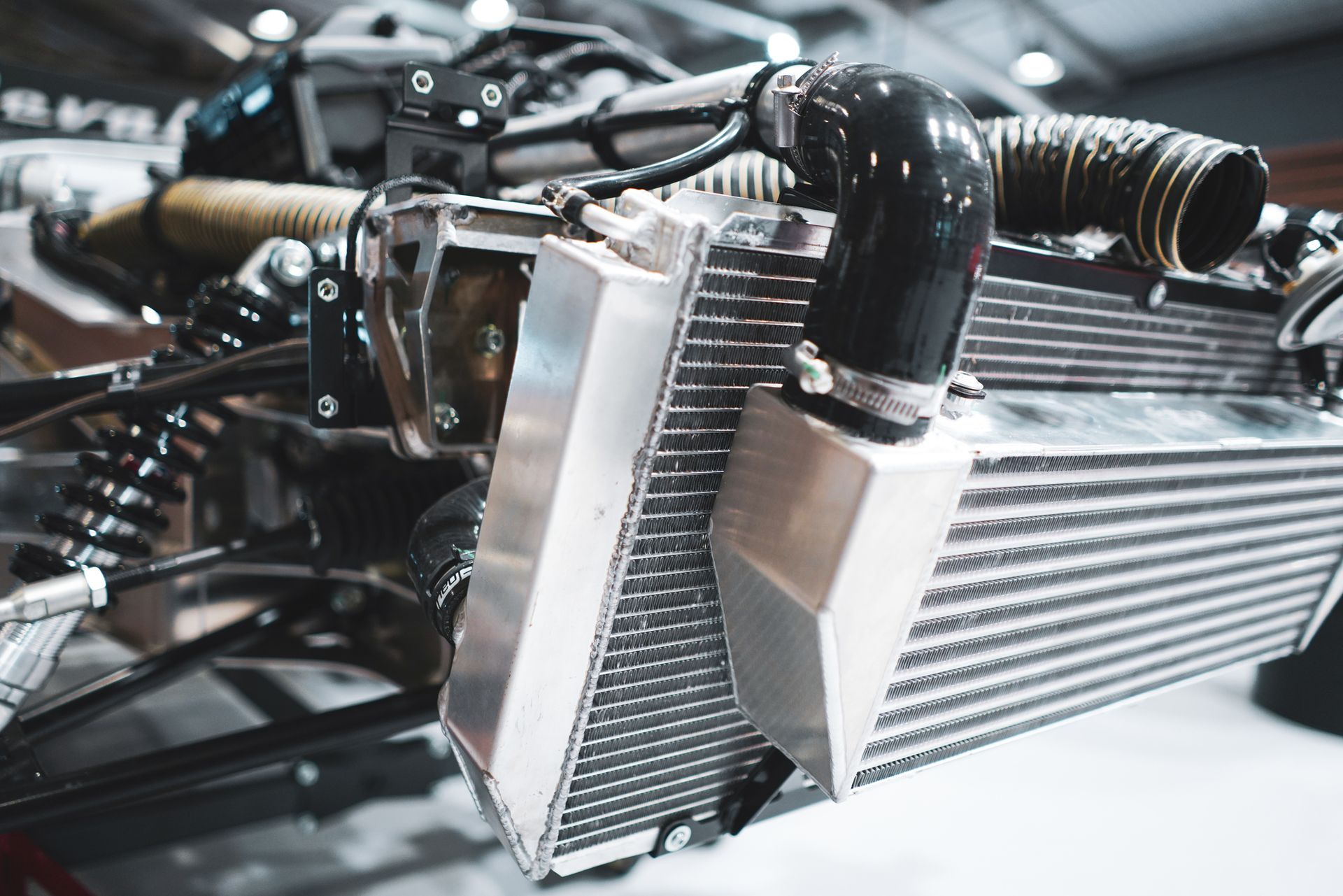 A close up of a radiator on a car engine.