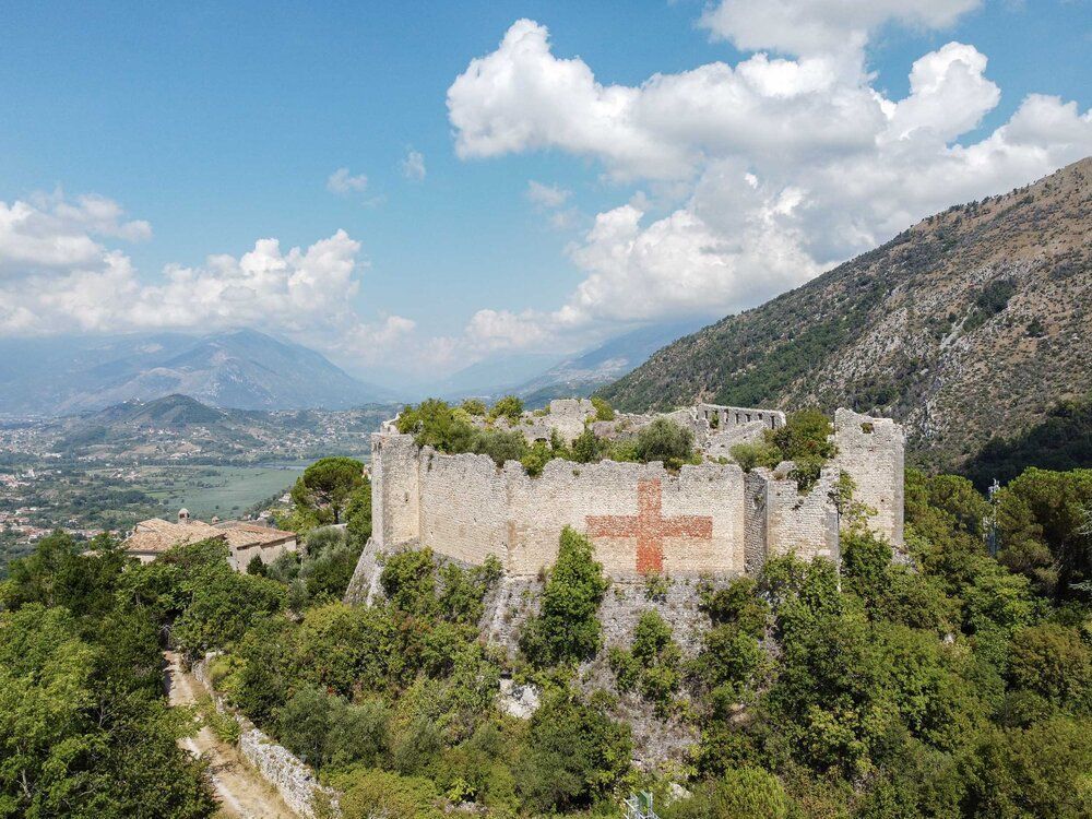 Vicalvi’s 11th-century Lombard castle rises atop a scenic hill in Comino Valley, guarding history near the wild beauty of the Abruzzo Apennines.