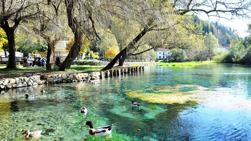 Lago di Posta Fibreno—a serene karstic lake in Lazio, famed for its crystal-clear waters, floating island, and rich biodiversity in a nature reserve.