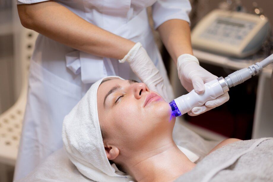 a woman is getting a facial treatment in a beauty salon .