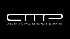 Logo of Atlanta Motorsports Park: white text on black background; “AMP” above “ATLANTA MOTORSPORTS PARK”.