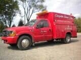 Side view of a red vehicle - Towing in Lynwood, IL