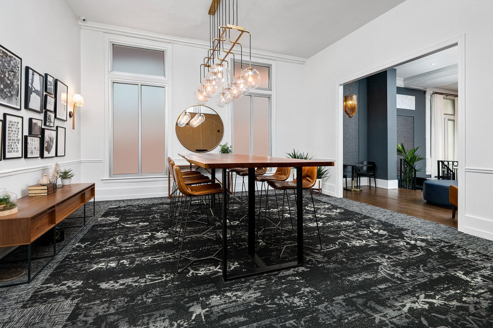 a dining room with a table and chairs and a chandelier