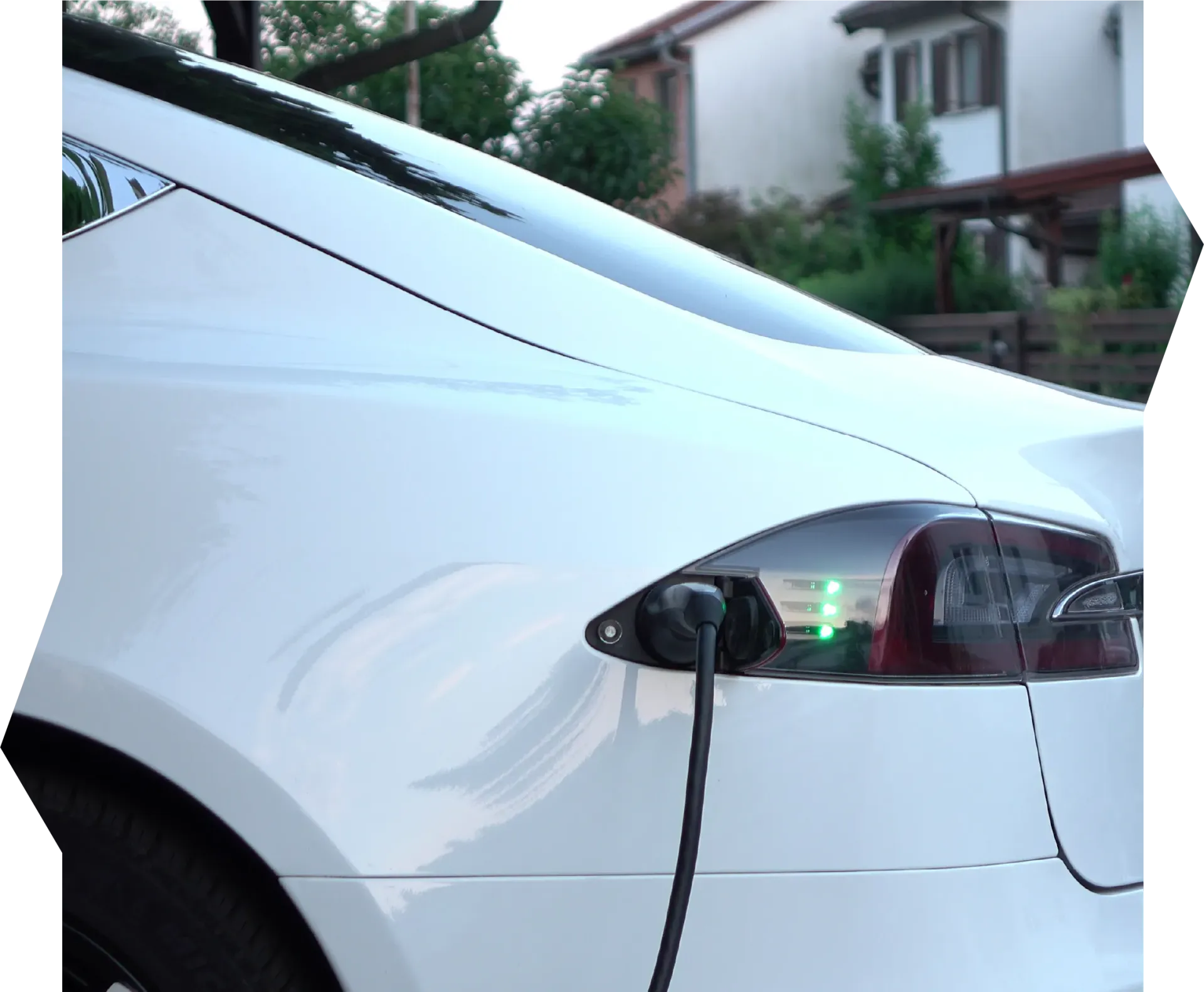 A person is opening a car door with a key.