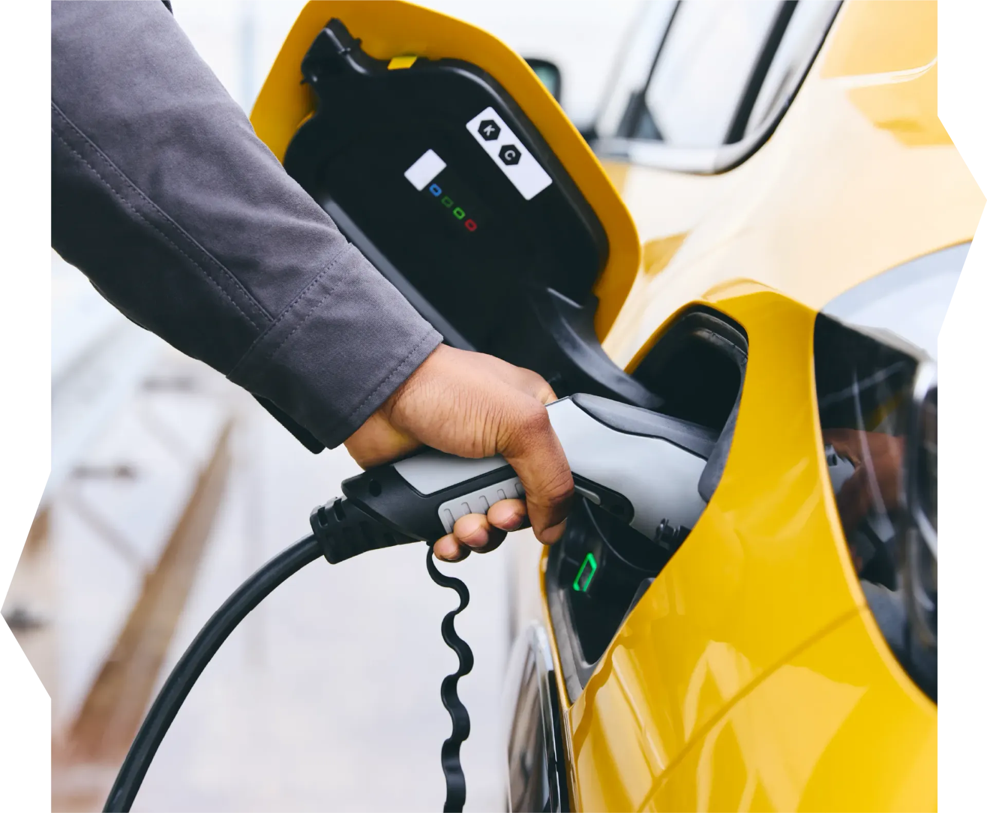 A person is opening a car door with a key.