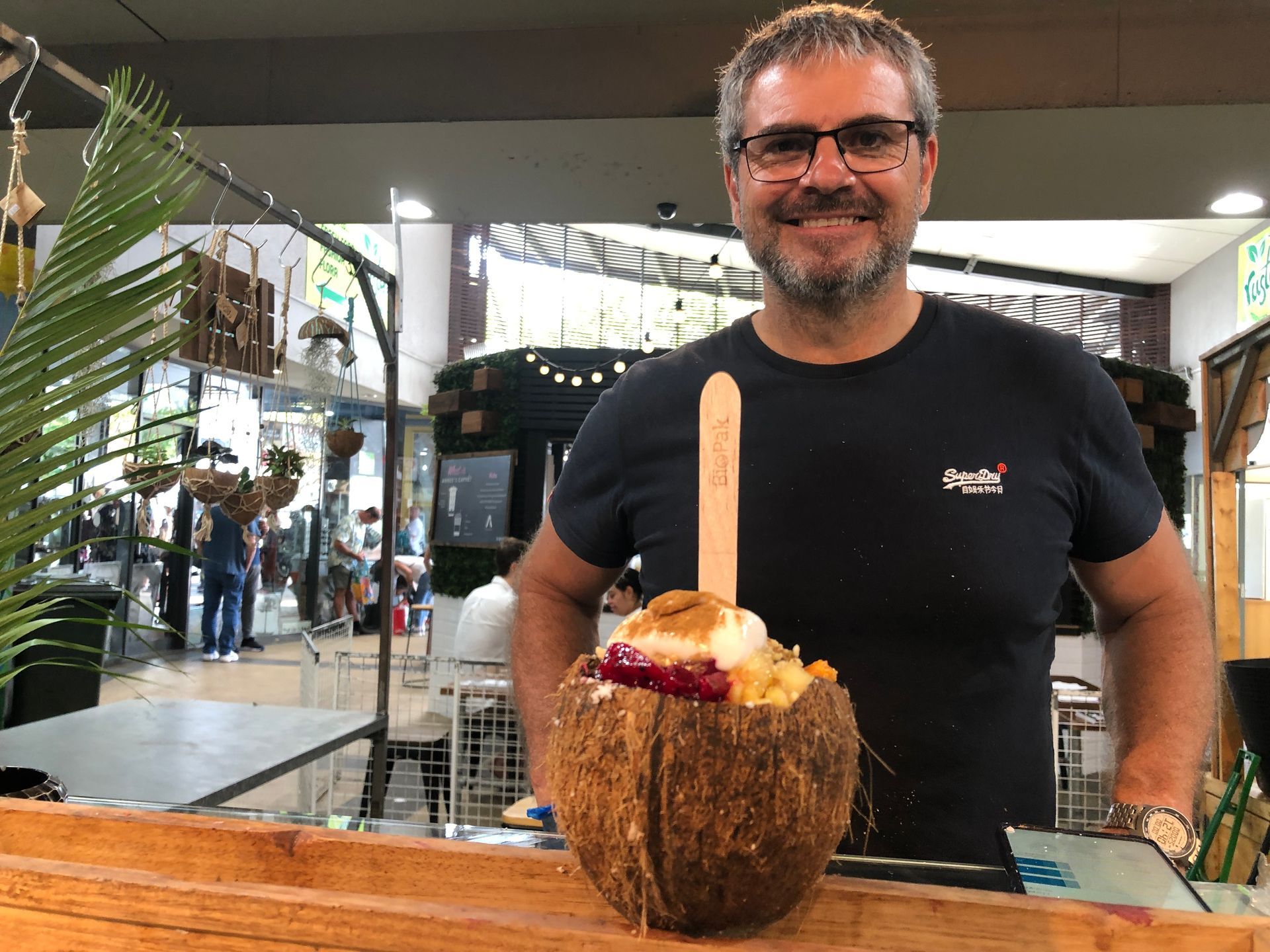 Rusty’s Market in Cairns with fresh tropical produce and local stallholders on a busy morning.