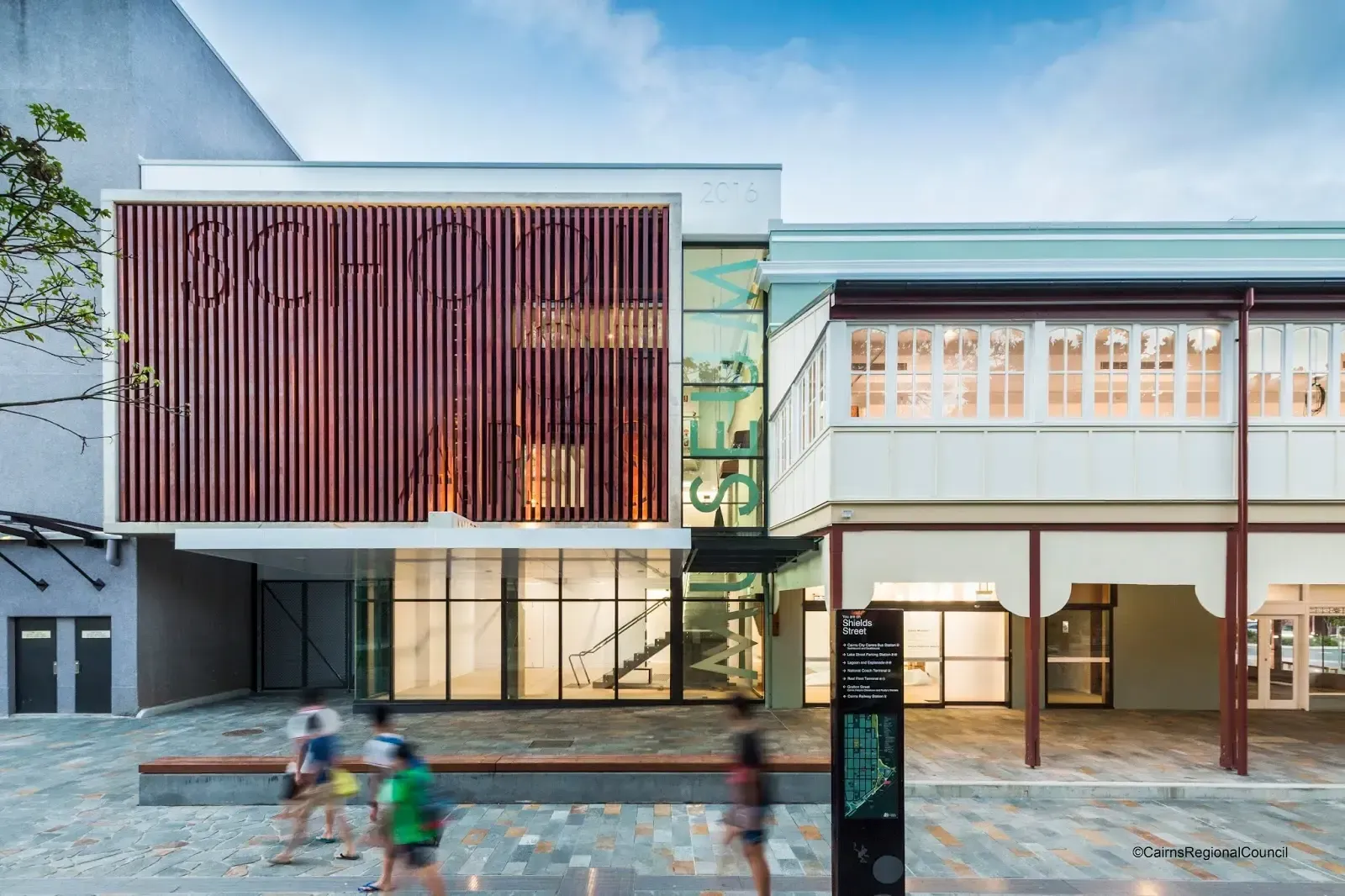 Modern exterior of Cairns Art Gallery and Cairns City Library on Shields Street in Cairns CBD, Queensland, featuring contemporary architecture and heritage building frontage, popular cultural attraction and rainy-day activity for visitors to Cairns.