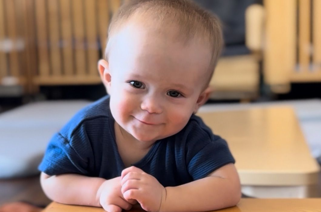 Montessori infant smiling