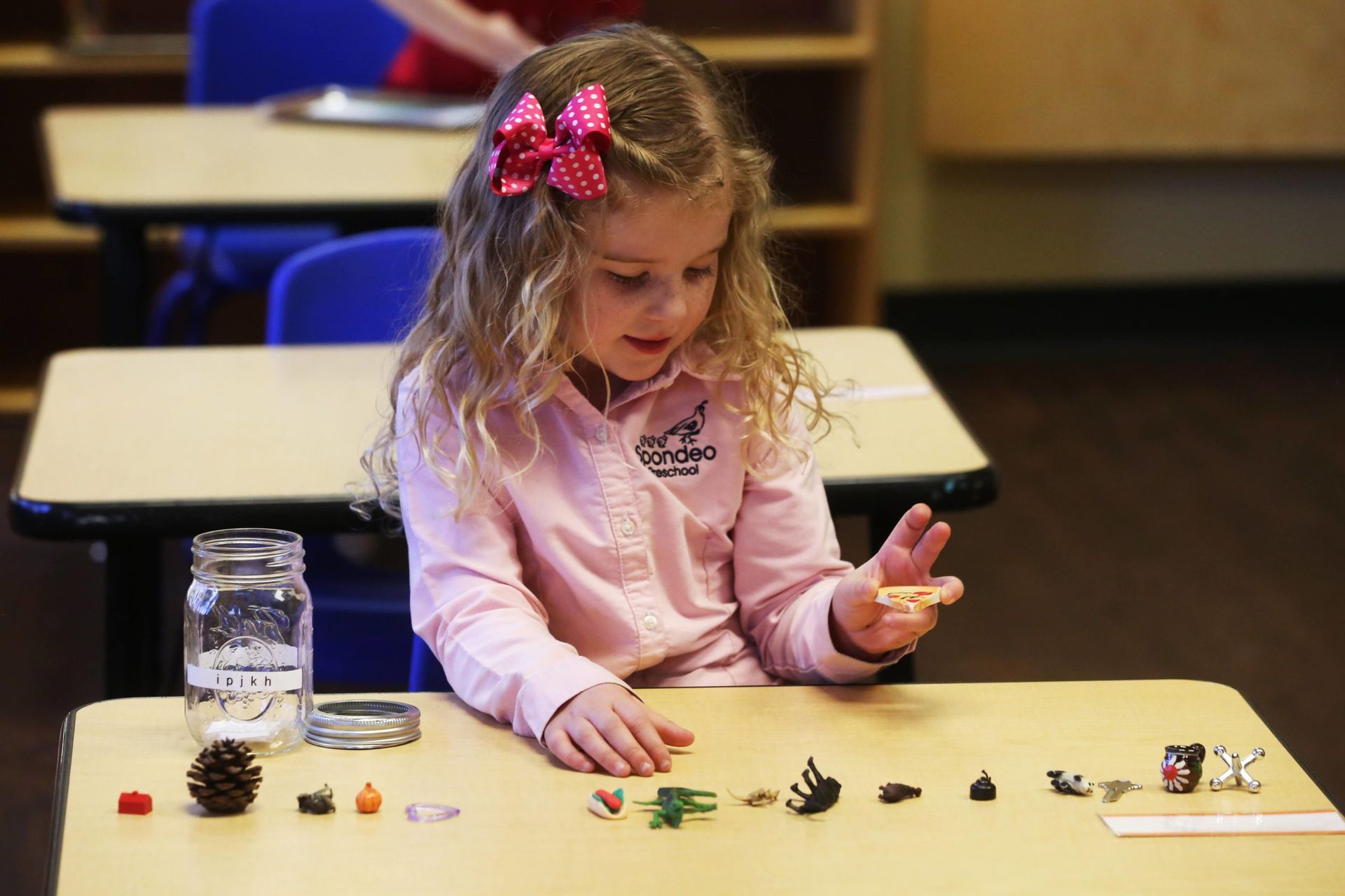 Montessori child working with Montessori materials