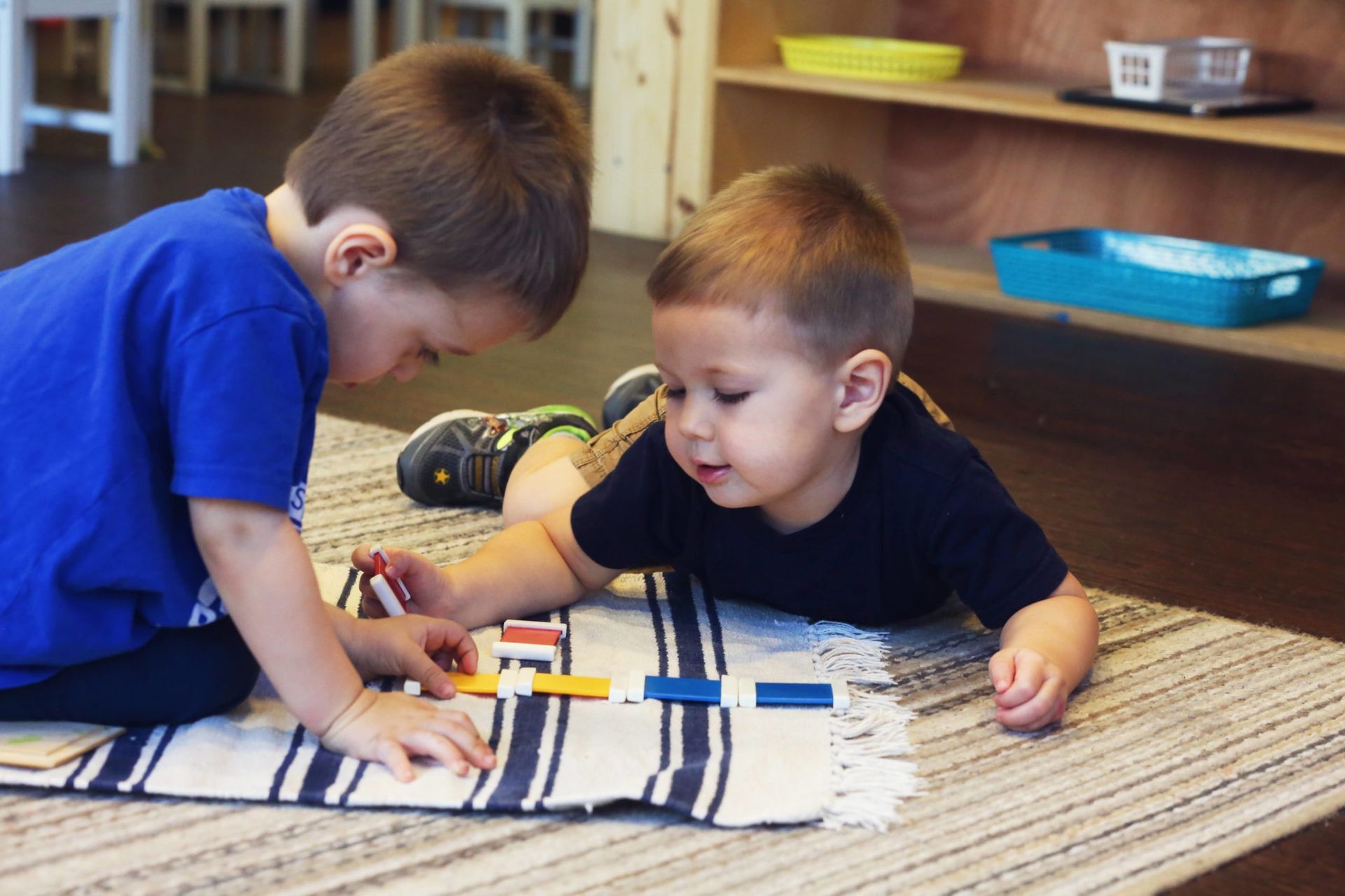 Montessori Toddlers working with coloured tablets