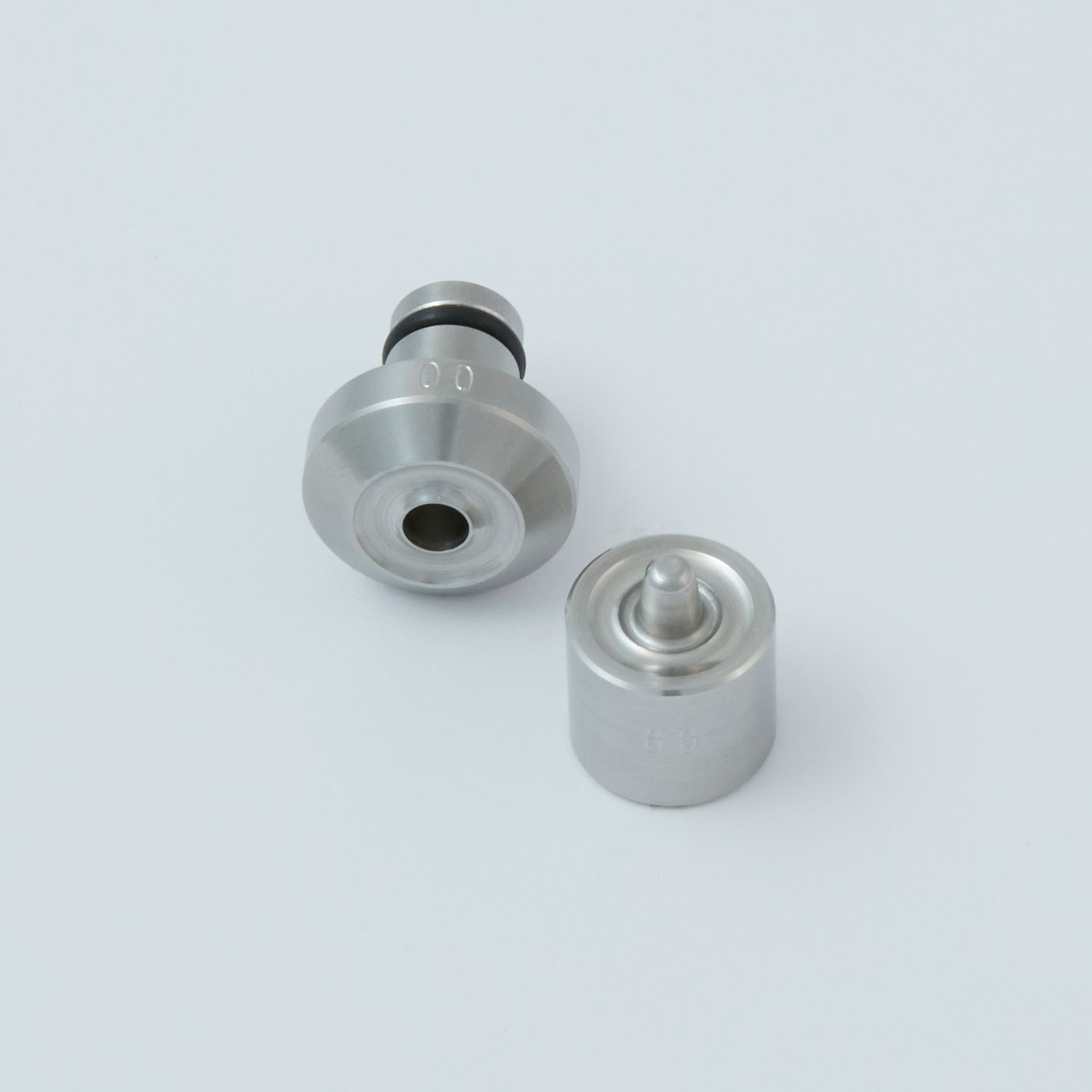 Black tool with a serrated end and a small metal clip next to it.