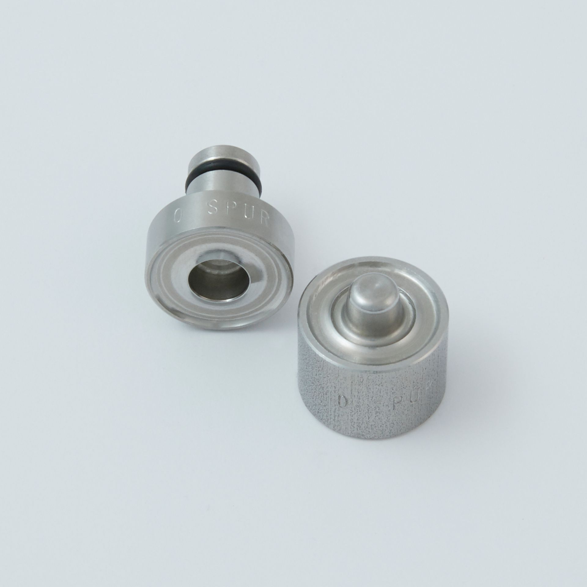 Black tool with a serrated end and a small metal clip next to it.