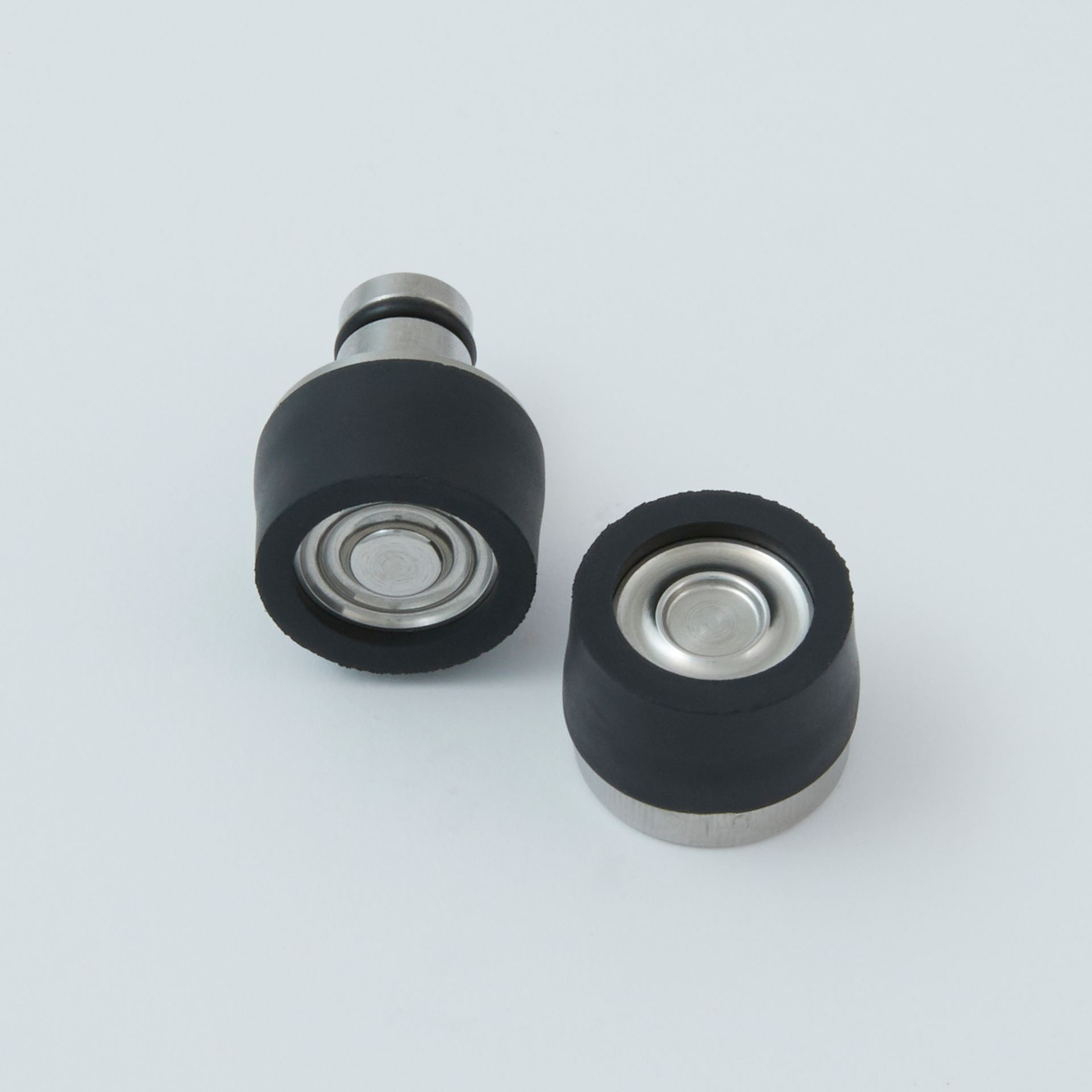 Black tool with a serrated end and a small metal clip next to it.