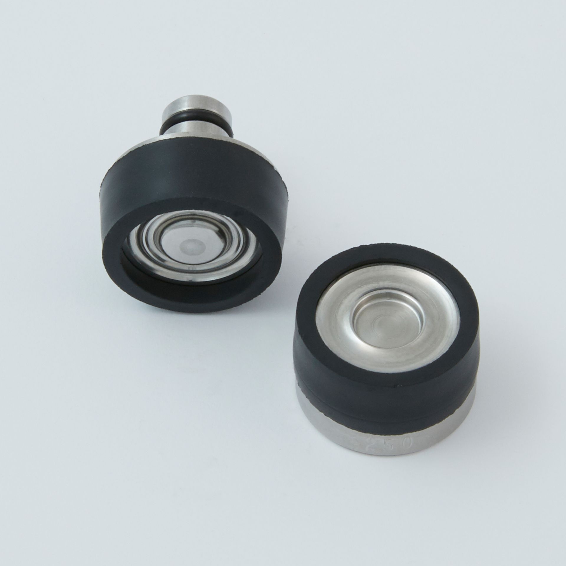 Black tool with a serrated end and a small metal clip next to it.