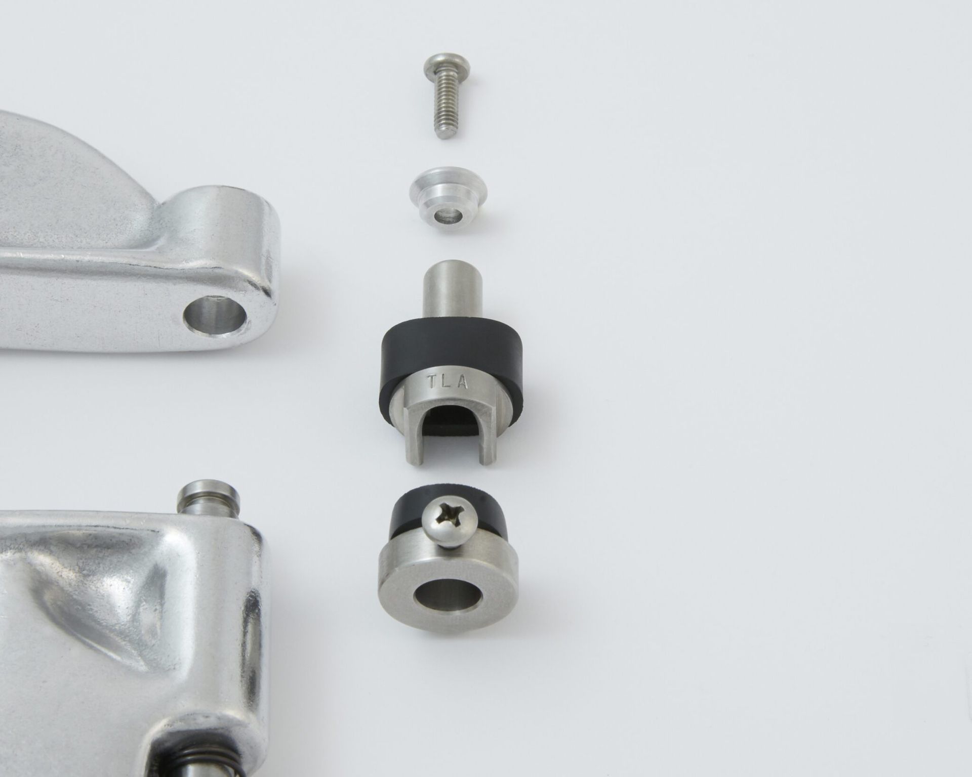 Exploded view of metallic lever components including a screw, washer, grommet, and bracket.