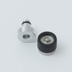 Black tool with a serrated end and a small metal clip next to it.