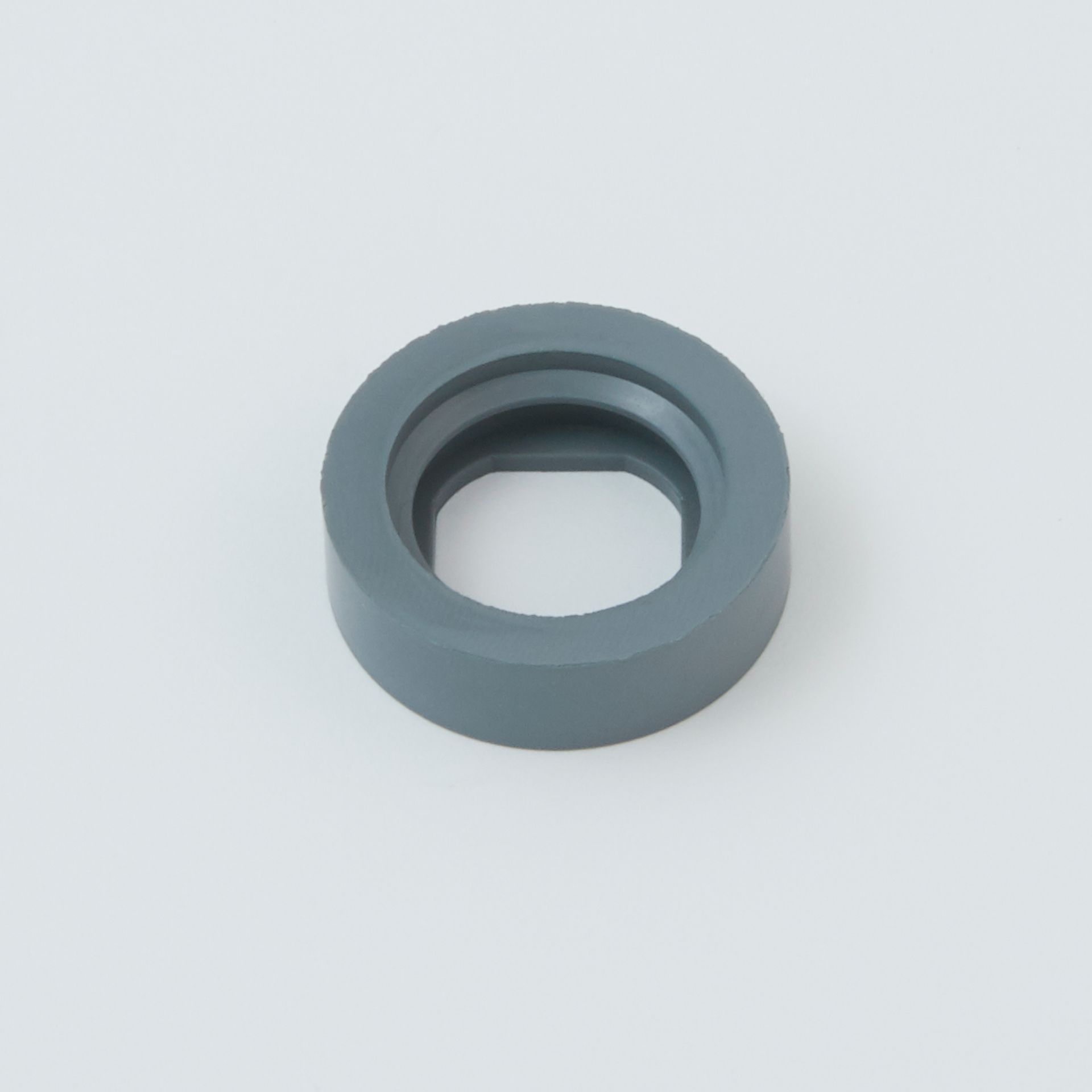 Black tool with a serrated end and a small metal clip next to it.