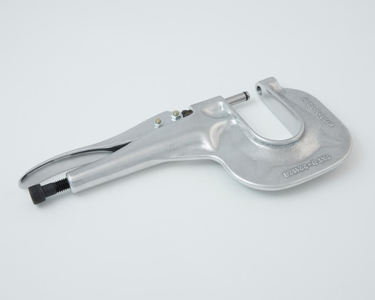 Metal rivet gun, silver, on a white background.