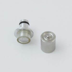 Black tool with a serrated end and a small metal clip next to it.