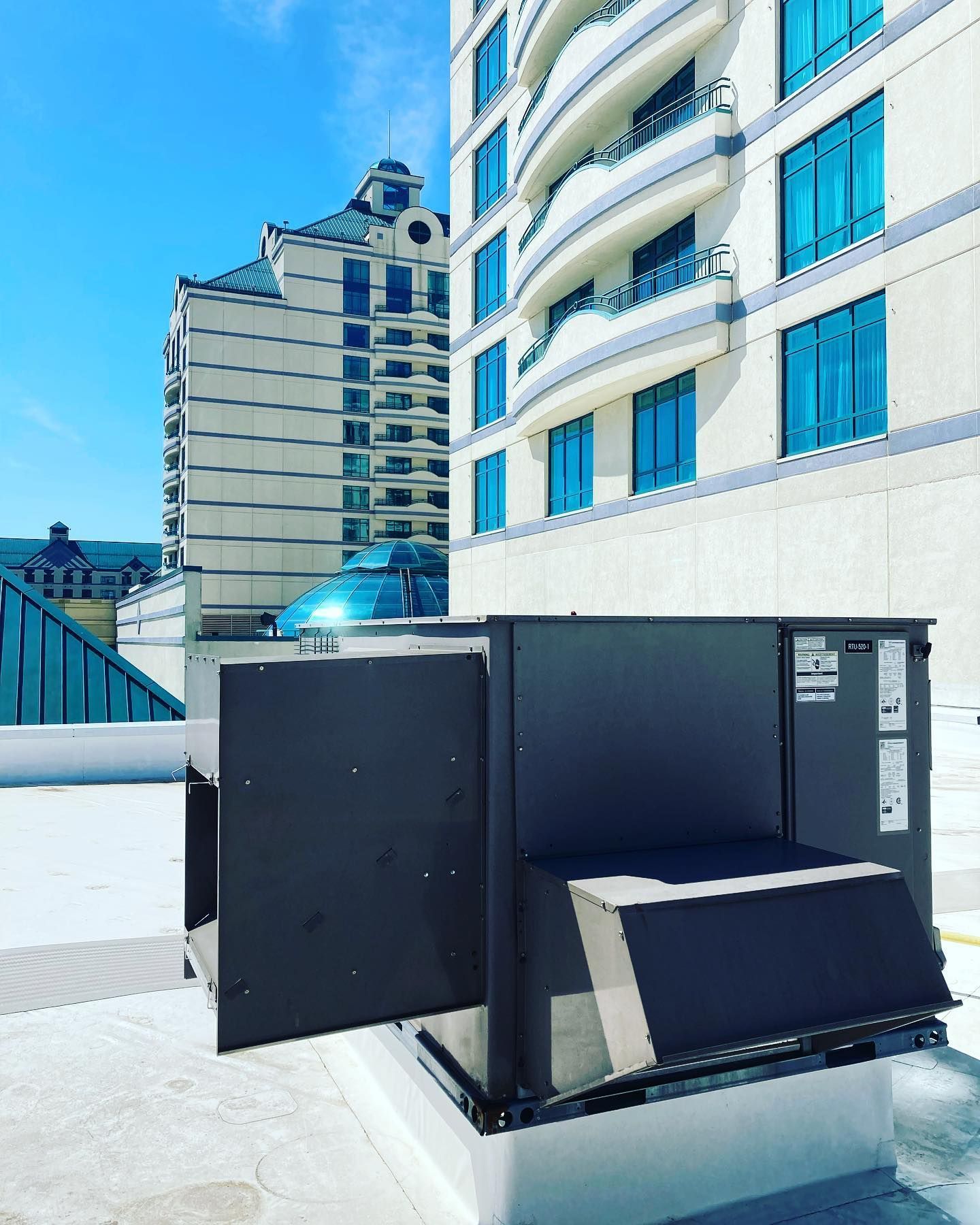 A large building with a black box in front of it