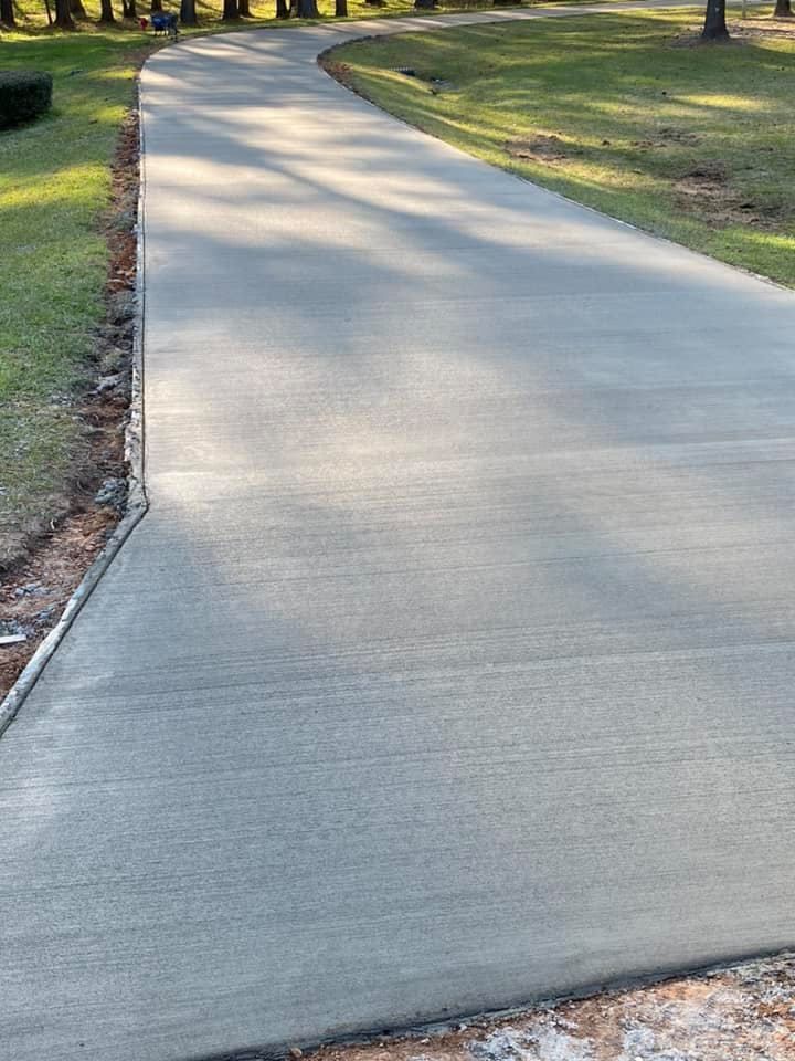 A concrete driveway is being built in a park.
