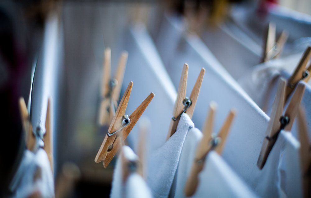 A Bunch of Clothespins Are Hanging on a Clothes Line — South Coast Clothes Lines in Gerringong, NSW