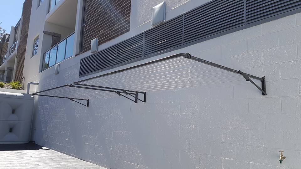 A Clothes Line is Attached to the Side of a Building — South Coast Clothes Lines in Gerringong, NSW