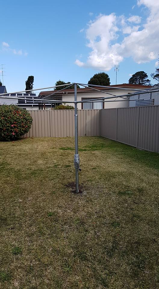 A Backyard With a Fence and a Clothes Line in Green Gas — South Coast Clothes Lines in Gerringong, NSW