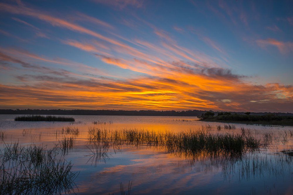 A Sunset Over a Lake With a Reflection of the Sky — South Coast Clothes Lines in Southern Highlands, NSW