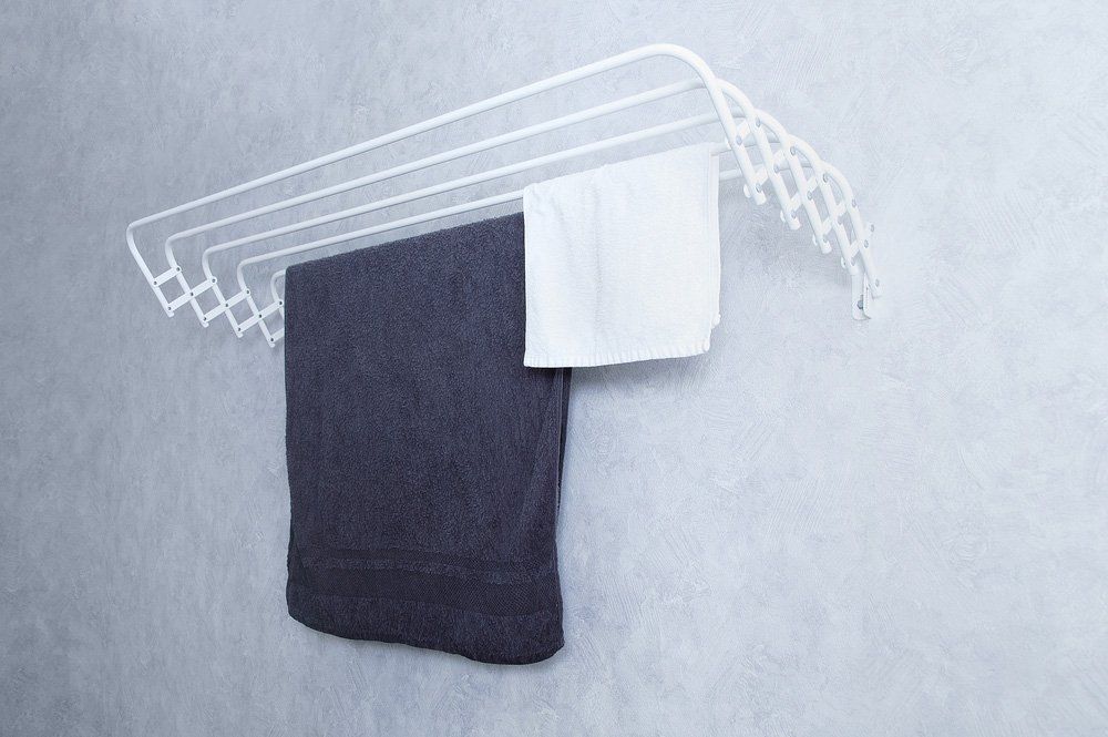 Two Towels Are Hanging on a Towel Rack on a Wall — South Coast Clothes Lines in Shellharbour, NSW