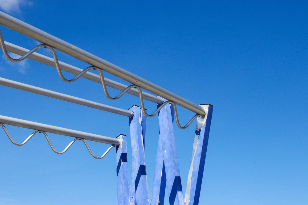 Blue Towels Are Hanging on a Clothes Line Against a Blue Sky — South Coast Clothes Lines in Nowra, NSW