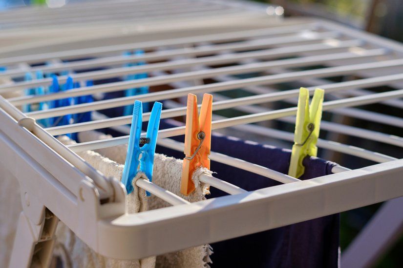 Clothes Are Hanging on a Clothes Drying Rack — South Coast Clothes Lines in Wollongong, NSW