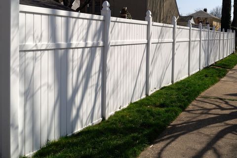 Vinyl Railings — Shaded White Vinyl Fence in Oaklyn, NJ
