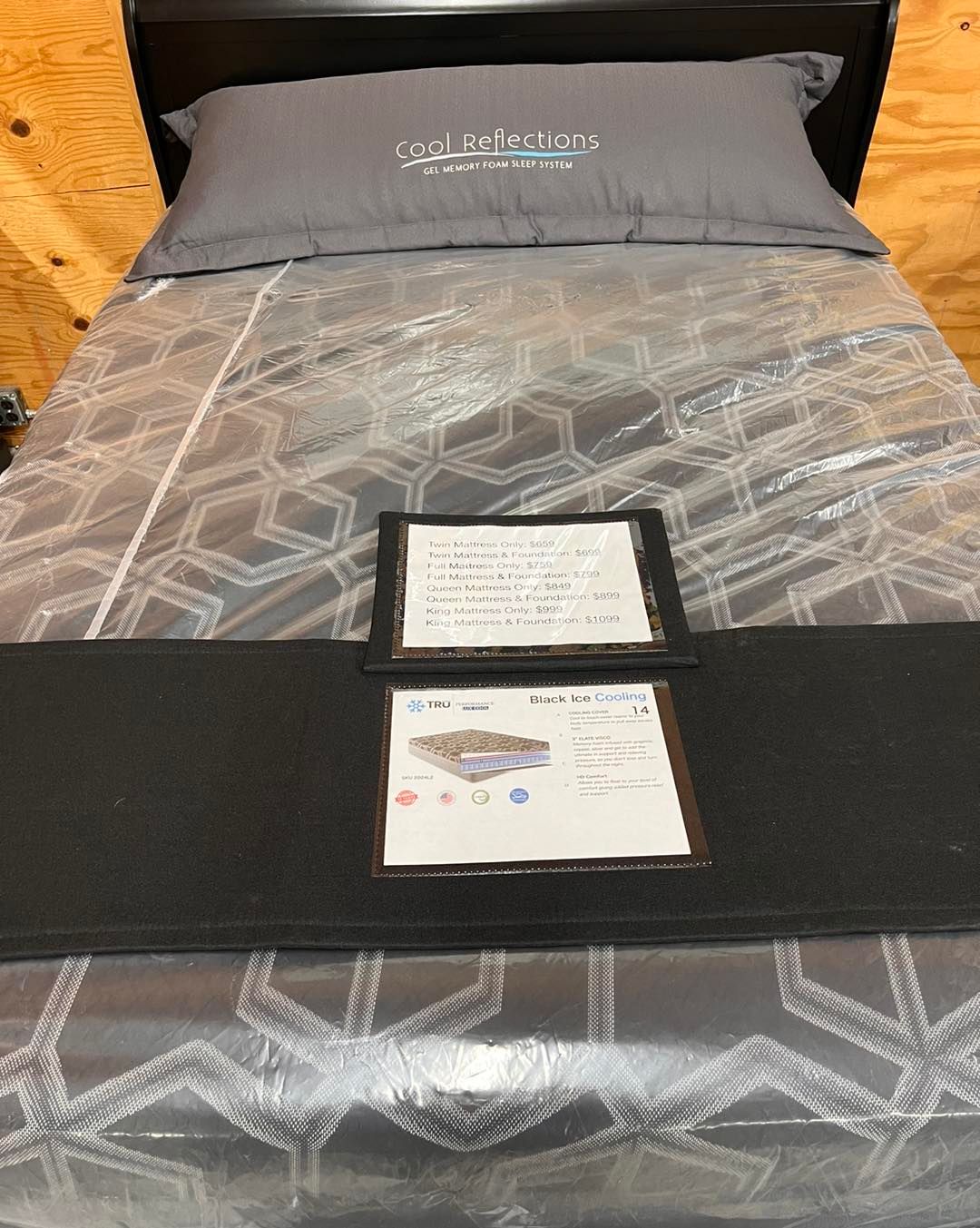 A bed with a pillow and a mattress on it.