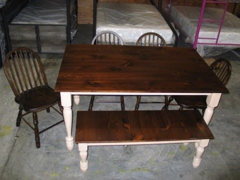 A wooden table with chairs and a bench