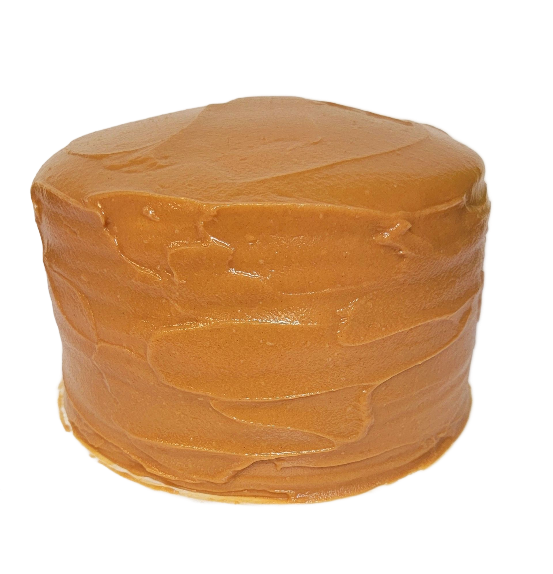 Cake with caramel-colored frosting, round shape, on a white background.