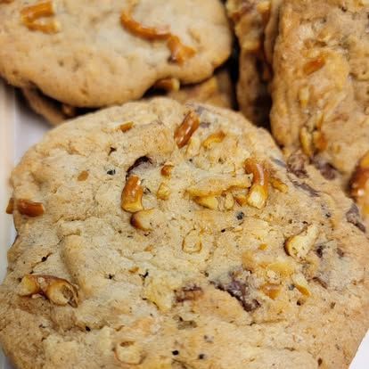 Close-up of several cookies with pretzel pieces baked into them.