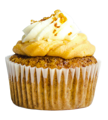 Cupcake with yellow frosting and white topping, sprinkled with golden flakes, in a white paper liner.