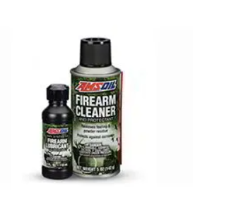 two bottles of amsoil firearm cleaner are sitting next to each other on a white surface .