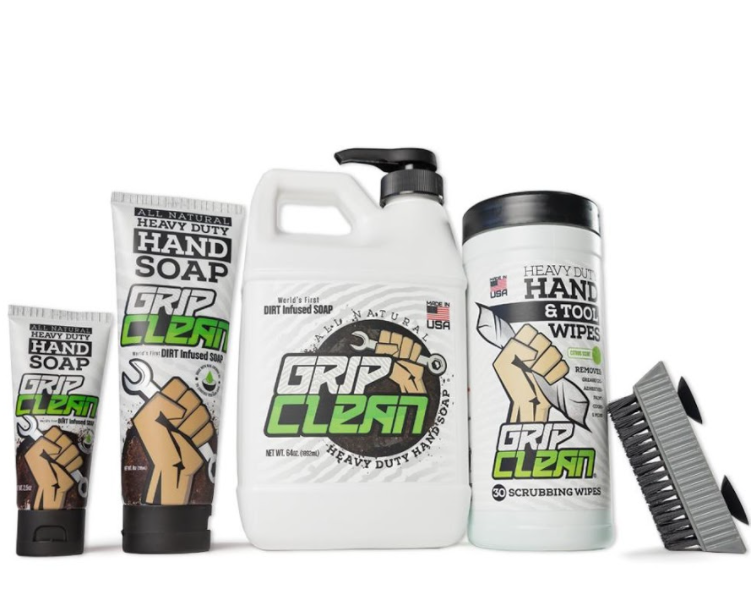 a bottle of grip clean hand soap , wipes , and a brush