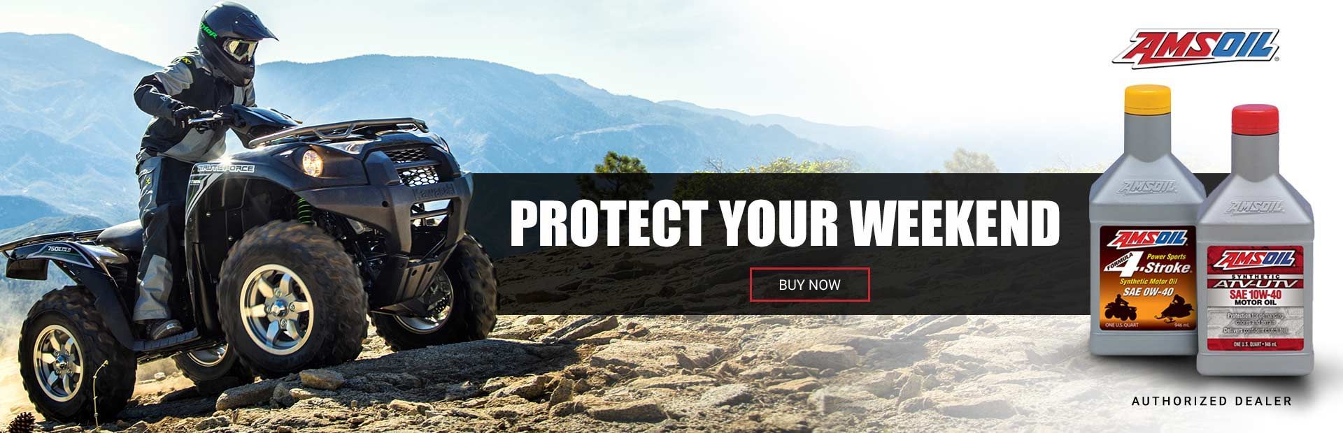a man is riding an atv on a dirt road .