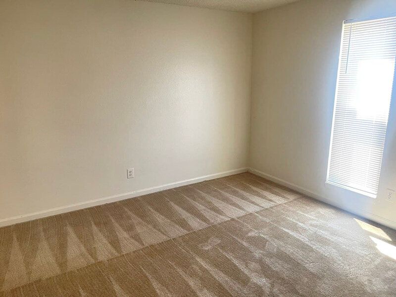 Carpeted Bedroom | Lakeside Villas Apartments in Thornton, CO