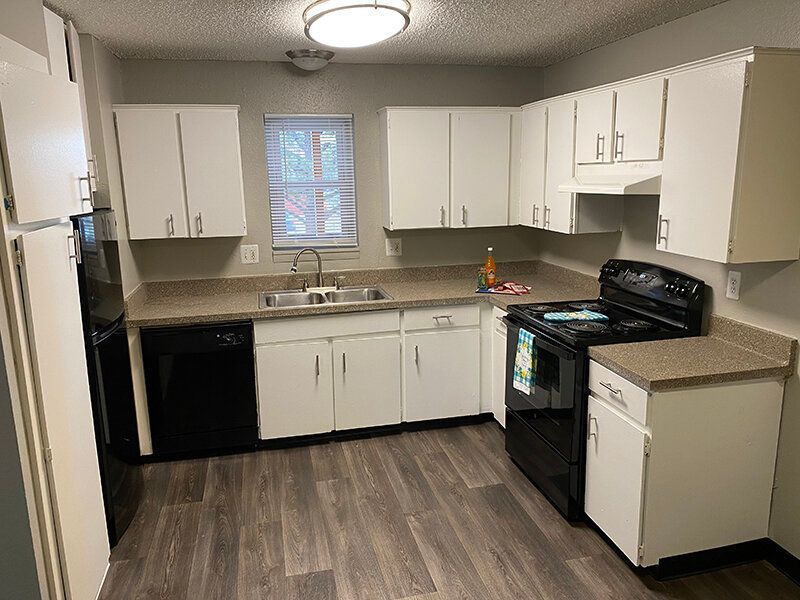 Kitchen with Black Appliances | Lakeside Villas Apartments