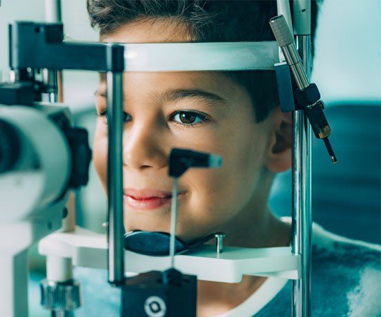 Contacts — Ophthalmologist examining boy's eyes in Highland, IN