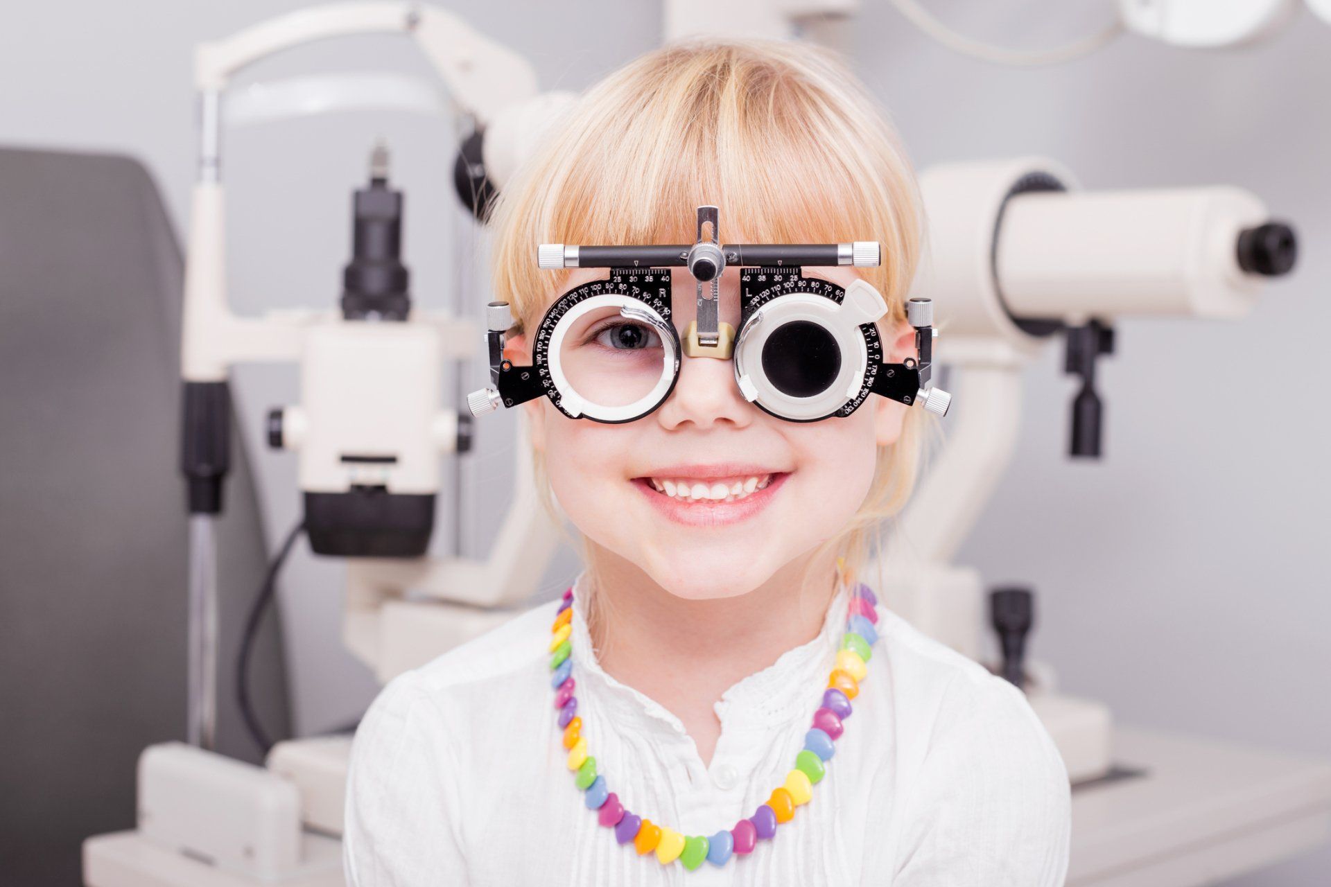 Eye Exams — Little girl checking her vision in Highland, IN