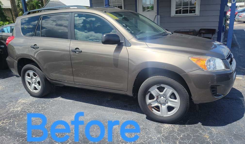 Before photo of wheel change of aBrown car.