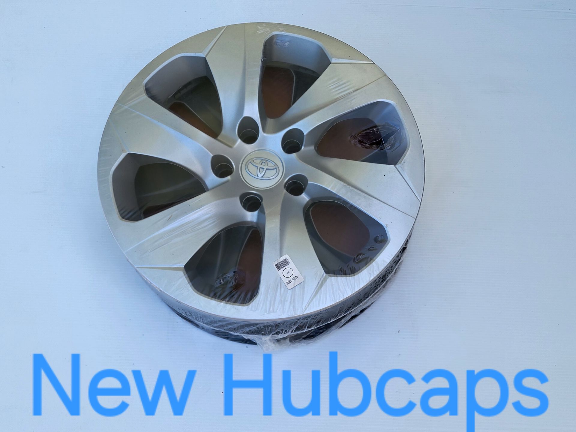 White cargo van with chrome wheels in a parking lot. White cargo van with chrome wheels in a parking lot.