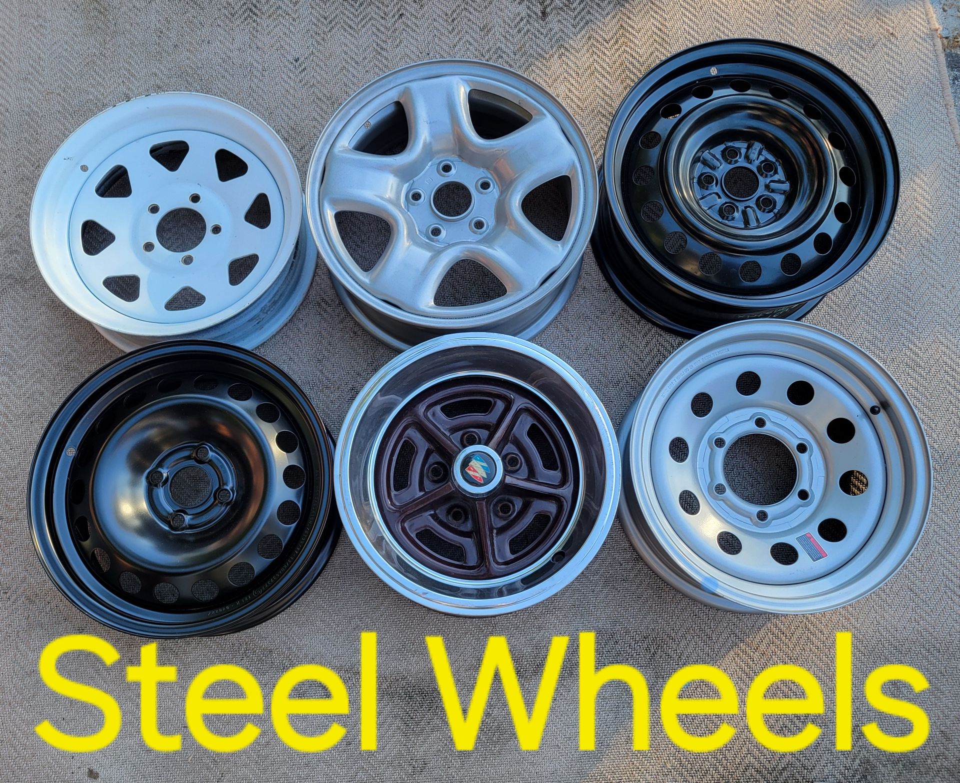 White pickup truck with a ladder rack in an outdoor setting. White pickup truck with a ladder rack in an outdoor setting.