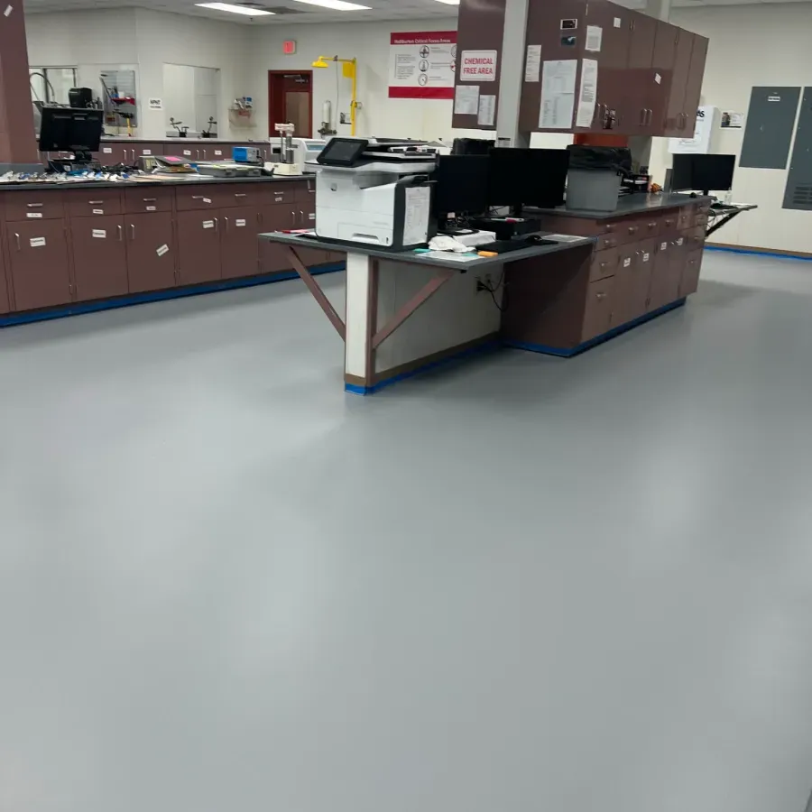 A large room with a printer on a desk